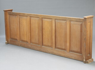A 19th Century oak pew front of panelled construction 84cm h x 229cm w x 25cm d (inside measurement 84cm h x 219cm w x 14cm d)
