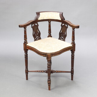 An Edwardian inlaid mahogany corner chair raised on turned supports with X framed stretcher 70cm h x 62cm w x 55cm d  (seat 30cm x 34cm) 
