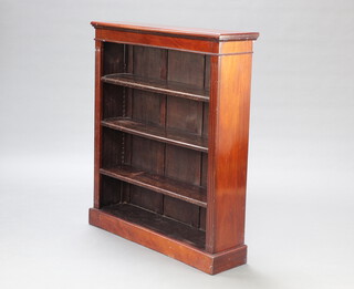 A Victorian mahogany open bookcase with adjustable shelves having fluted columns to the sides, raised on a platform base 107cm h x 91cm w x 25cm d 