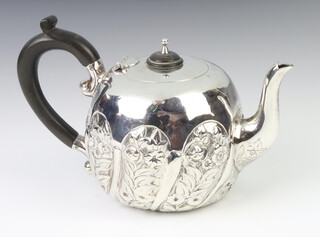 A Victorian silver baluster breakfast teapot with repousse floral decoration, London 1893, with ebonised handle, gross weight 212 grams