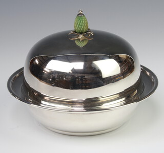 An Edwardian silver plated muffin dish and cover with carved stained ivory pineapple finial 