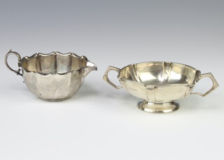 An Edwardian silver 2 handled cup Birmingham 1909, a ditto cream jug Sheffield 1902 160 grams 