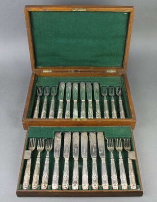 An oak canteen of plated fish eaters for 12 with engraved blades contained in an oak canteen 