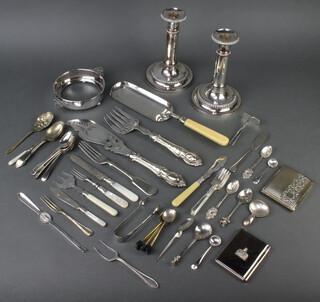 A pair of silver plated telescopic candlesticks and minor plated cutlery 