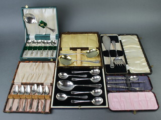 A cased set of silver plated ribbon and bow grapefruit spoons, pair of ditto serving spoons, pair of fish servers, a 3 piece christening set, set of dessert spoons, a crumb tray, cake knife and dessert spoons