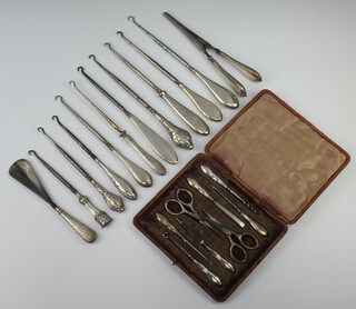 A silver button hook London 1902, a matched manicure set and 11 other mounted implements 