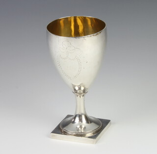 A George III silver goblet with engraved armorial and vacant cartouche by Thos Chawner, London 1786, 156 grams, 15cm 