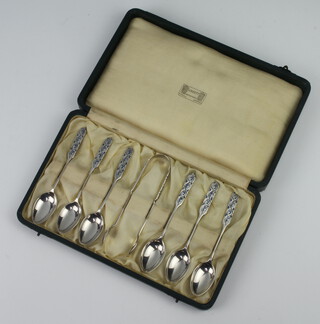 A cased of silver and enamelled teaspoons and sugar tongs, Liberty & Co 1925/26/49, in original fitted case, 96 grams 