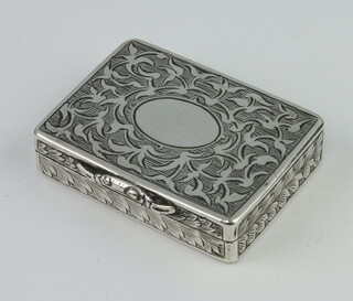 A Victorian silver rectangular vinaigrette with engraved scroll decoration and vacant cartouche, having a gilt floral grill, Birmingham 1857, 4.5cm x 3cm, 30 grams 