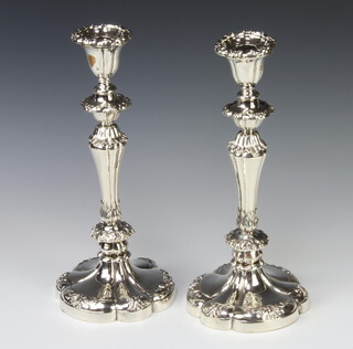 A pair of Georgian style silver tapered candlesticks and sconces Sheffield 1929, maker Mappin & Webb, 33cm