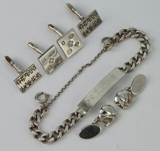 A pair of silver cufflinks, 2 other pairs and an identity bracelet 72 grams 