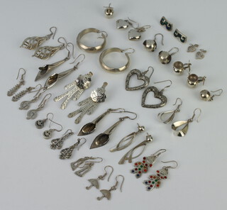 A collection of silver earrings 198 grams 