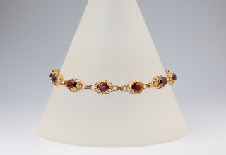 An 18ct yellow gold ruby set bracelet 10.8 grams 