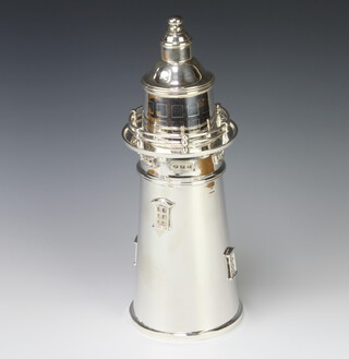 A novelty reproduction silver plated cocktail shaker in the form of a lighthouse 35cm 