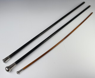 A Victorian ebonised cane with silver knop, London 1863 and 2 others