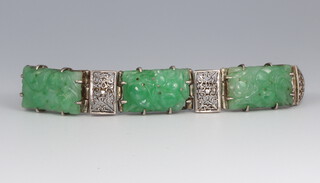 A white metal and 3 plaque carved green hardstone Art Deco bracelet, 16cm 