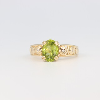 A 9ct yellow gold peridot ring, size N 1/2, 3.4 grams 