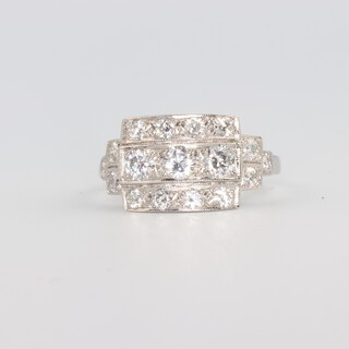 A platinum Art Deco style brilliant cut diamond ring 1.25ct, 17 diamonds, 5.6 grams, size M