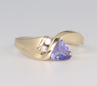 A 9ct yellow gold crossover tanzanite and diamond ring 2.5 grams, size L 1/2