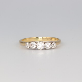 An 18ct yellow gold 5 stone graduated diamond ring, size M 1/2, 2.5 grams, approx. 0.6ct 