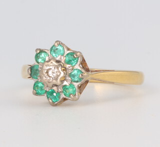 An 18ct yellow gold emerald and diamond cluster ring 3.1 grams, size I 1/2 