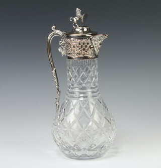 A cut glass silver plated mounted repousse claret jug with a lion finial 31cm 