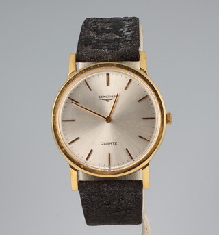A gentleman's gold plated Longines quartz wristwatch contained in a 32mm case on a distressed leather strap 