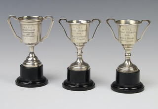 Three silver trophy cups Birmingham 1936 9cm on plastic socles 