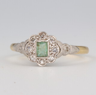 An Edwardian 18ct yellow gold emerald and diamond cluster ring 2.5 grams, size R 1/2