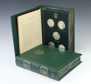 Fifty cased silver medallions, The Mountbatten Medallic History of Great Britain and The Sea, contained in 2 folders with a signed certificate, each approx. 38 grams by John Pinches (approx. 1900 grams) 