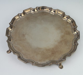 A silver salver with pie crust rim on pad feet Birmingham 1936, 496 grams, 25cm 