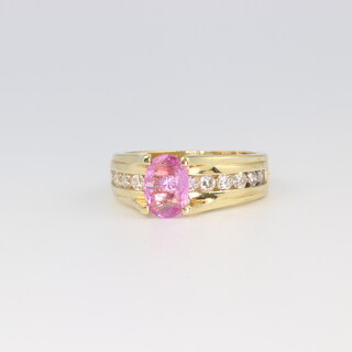 An 18ct yellow gold pink sapphire and diamond ring 7.6 grams, size M 