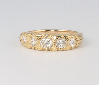 A Victorian style yellow metal 18ct, 5 stone graduated diamond ring 1.3ct, size O, 6 grams, with WGI certificate  