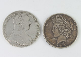 A Maria Theresa thaler together with a 1922 dollar 