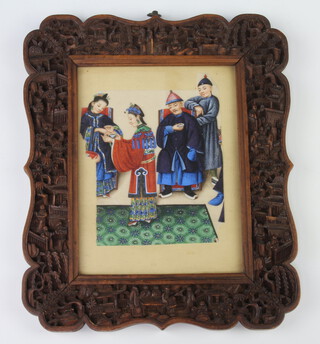 An early 20th Century carved Cantonese hardwood frame with pavilions, figures and flowers 22cm x 18cm containing a reduced painting on rice paper of attendants with figures 