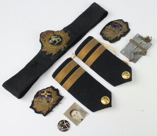 A Cunard Officer's cap badge, 2 Merchant Navy epaulettes etc 