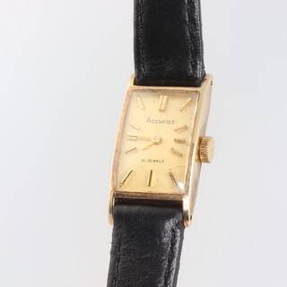 A lady's 9ct yellow gold Accurist wristwatch on a leather strap 