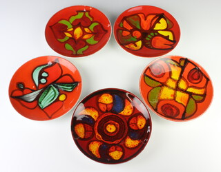 Five 1970's Poole red ground dishes with abstract decoration 20cm 