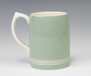 A Keith Murray Wedgwood pale green mug with ribbed decoration 11.5cm  