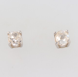 A pair of 18ct white gold mine cut single stone diamond ear studs. approx. 0.25ct each, 1.1 grams  