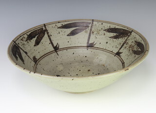 A flared rim Studio bowl decorated with stylised leaves in the Chinese manner 39cm 