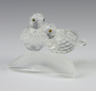 A Swarovski Crystal Collectors Society figure of 2 birds on a trunk 8cm boxed