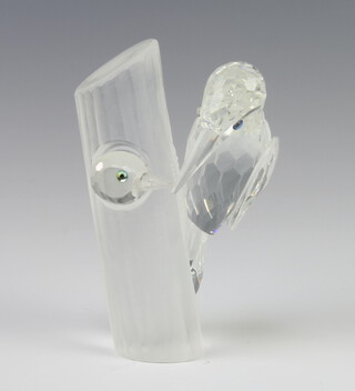 A Swarovski Crystal figure of a woodpecker on a trunk with another poking his head out 11cm boxed