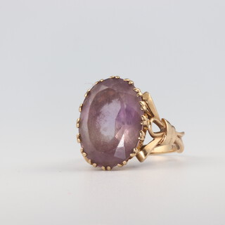 A 9ct yellow gold oval amethyst dress ring, size O 1/2, 8.4 grams 
