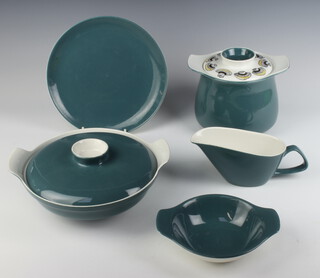 A vintage Poole Pottery dinner service comprising 3 small plates, 7 dinner plates, 5 dessert bowls, a tureen and cover, a casserole and cover, casserole (no cover) and a gravy boat
