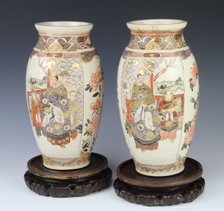 A pair of early 20th Century oviform Satsuma vases decorated with panels of figures and flowers 30cm, with wooden stands