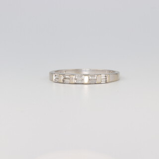 An 18ct white gold 10 stone baguette ring, each stone approx. 0.01ct, 2.6 grams, size L 1/2
