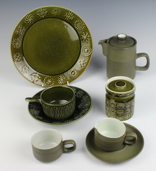 A 1970's Denby coffee service comprising coffee pot, 6 cups, 6 saucers, a milk jug and sugar bowl together with a Portmeirion part service of 2 saucers, 4 small plates, 7 medium plates, 3 dinner plates, 4 dessert bowls, 2 shallow bowls, 3 small plates, 2 lidded jars and a sauce boat 