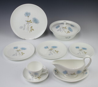 A Wedgwood Ice Rose pattern part dinner service and tea service comprising 6 tea cups, 6 saucers, 6 small plates, 6 side plates, 6 dinner plates, oval meat plate, sauce boat and stand, 6 soup bowls and saucers, an oval dish, a vase