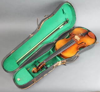 A viola with 2 piece back 16 and 1/8, the interior labelled Copy Antonius Stradivarius Faciebat Cremona 1730 Made in Western Germany, complete with bow and contained in a carrying case  